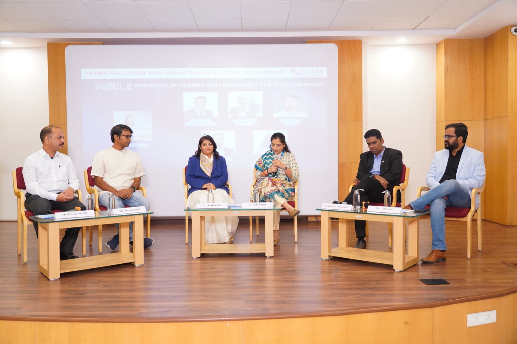 A panel on bridging academia and industry, Amit Kumar Soni seated at the right.