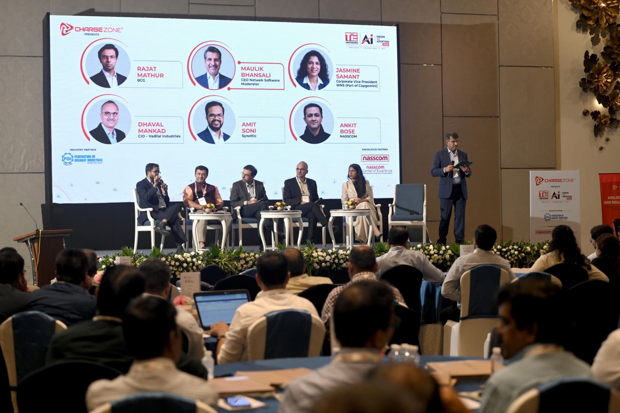 A panel discussion at Expedia with multiple speakers on stage and audience members.